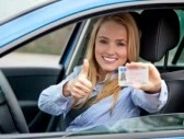 13343001-attractive-young-woman-shows-her-driving-licence
